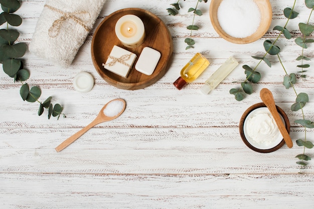 Flat lay spa products on wooden background
