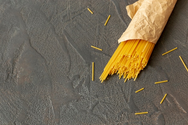 Flat lay of spaghetti on plain background