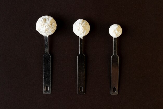 Flat lay spoons with powder