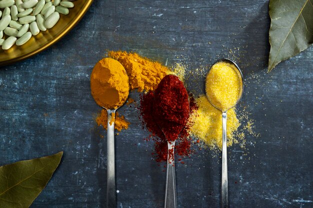 Flat lay spoons with spices arrangement