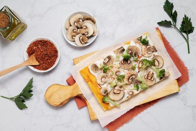 Flat lay square pizza on wooden board