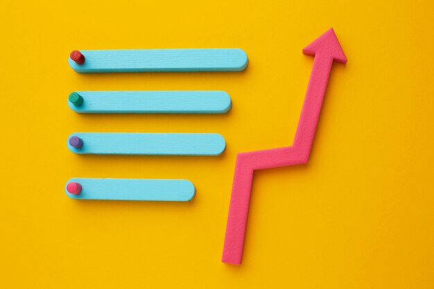 Flat lay of statistics presentation with chart and arrow