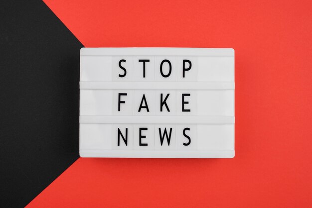 Flat lay stop fake news concept