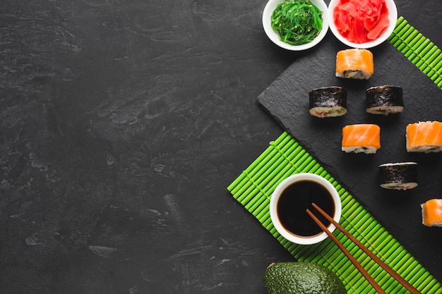 Flat lay sushi arrangement with copy space