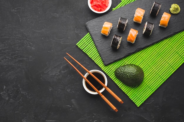 Flat lay sushi arrangement with copy space