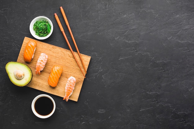 Flat lay sushi arrangement with copy space