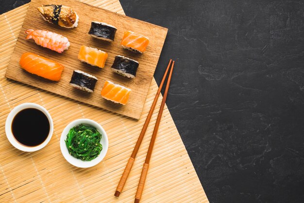 Flat lay sushi arrangement with copy space