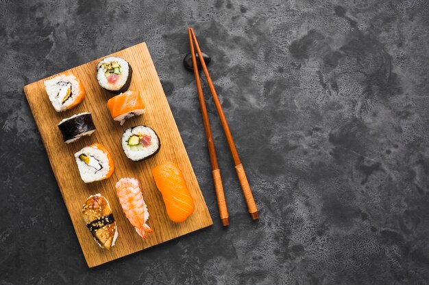 Flat lay sushi arrangement with copy space