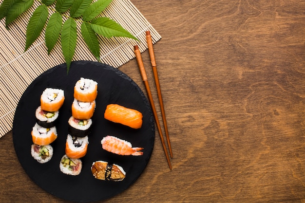 Flat lay sushi arrangement with copy space