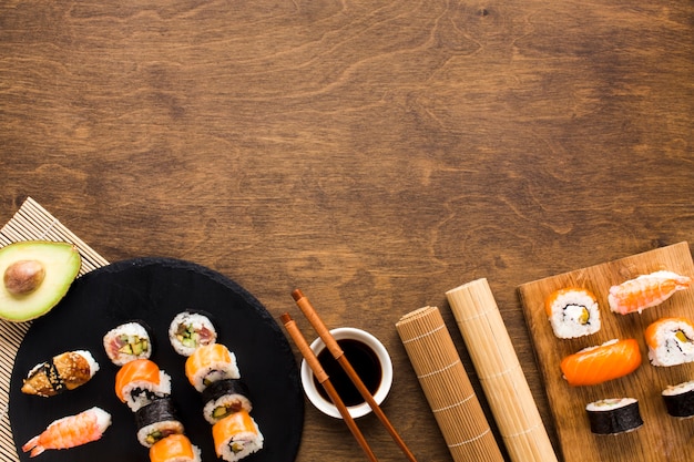 Free photo flat lay sushi arrangement with copy space