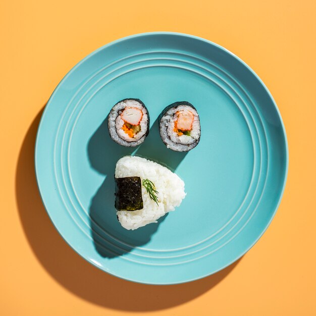 Flat lay sushi rolls with rice