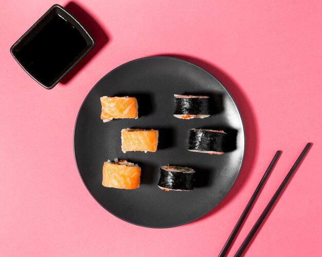 Flat lay sushi variety with soy sauce