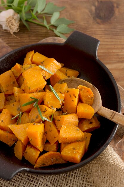 Flat lay sweet potatoes with herbs