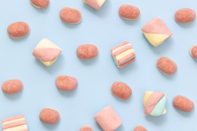 Flat lay sweets on blue background