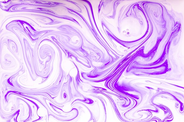 Flat lay of swirls of paint in liquid