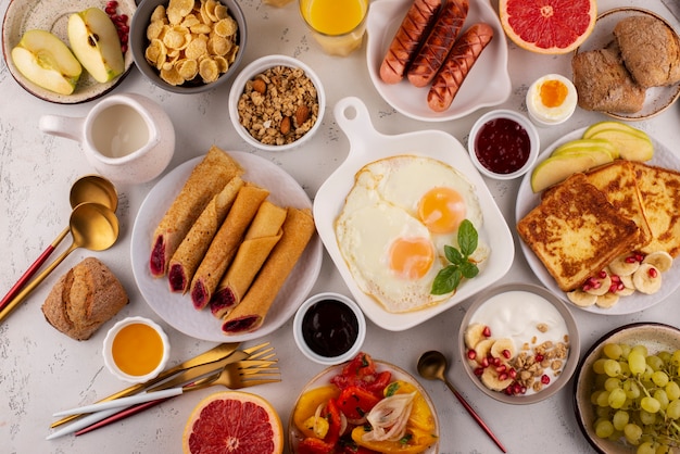 Flat lay table full of delicious food composition