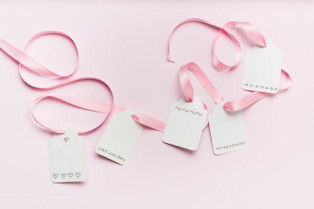 Flat lay of tags tied with ribbon