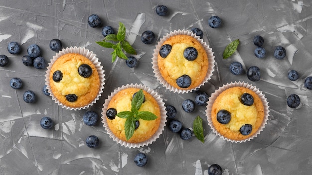 Flat lay tasty muffin with blueberries