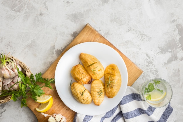 Flat lay tasty potatoes on plate