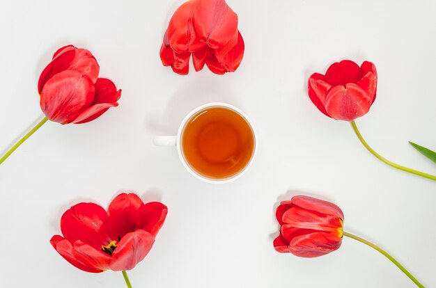 Flat lay tea composition with flowers