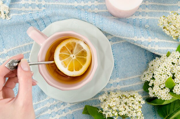 Flat lay tea composition with flowers