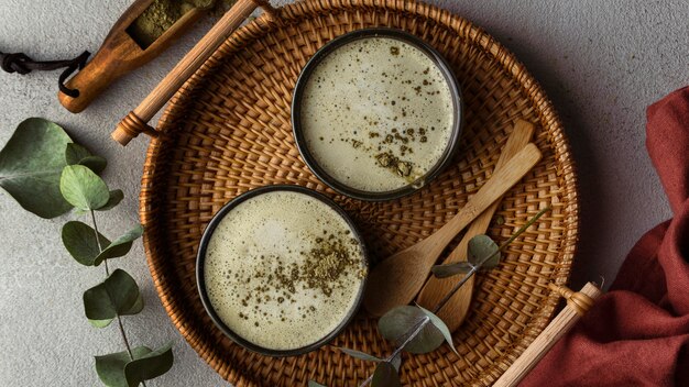 Flat lay tea cups and herbs