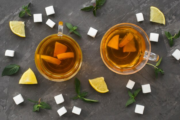 Flat lay of tea cups with sugar cubes