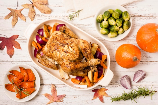 Flat lay of thanksgiving roasted chicken with ingredients