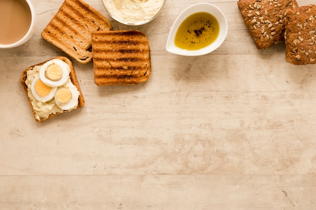 Free photo flat lay toast and boiled eggs with copy space