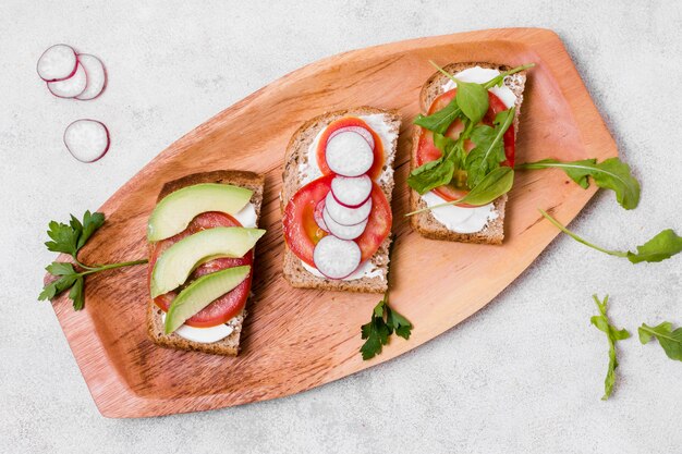 Flat lay of toast with variety of vegetables