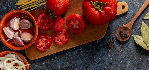Flat lay of tomatoes with veggies