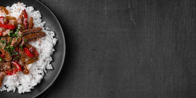 Free photo flat lay of traditional asian rice dish with meat