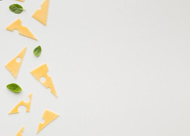 Flat lay triangular emmental cheese slices with copy spaces