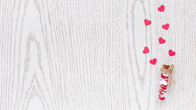 flat lay of tube with hearts and copy space for valentines day