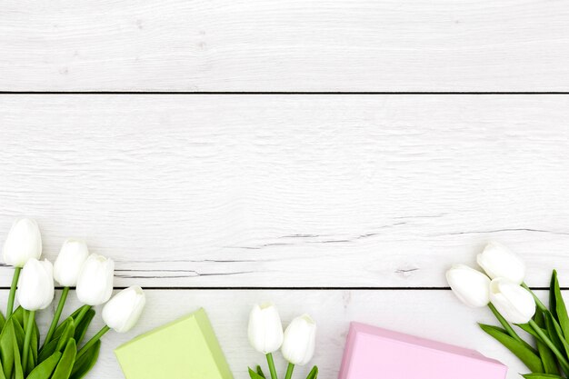 Flat lay of tulips on wooden table