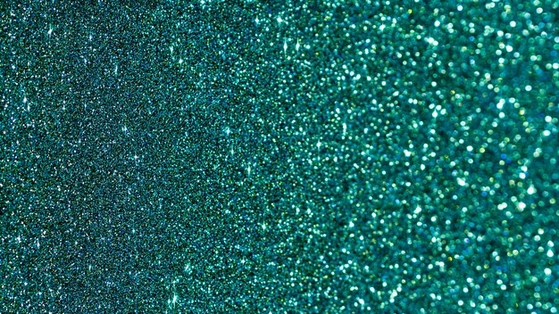 Flat lay turquoise glitter background