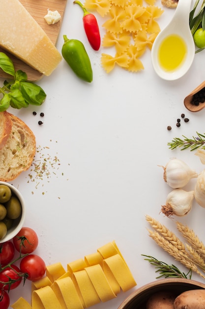 Flat lay uncooked pasta and ingredients frame