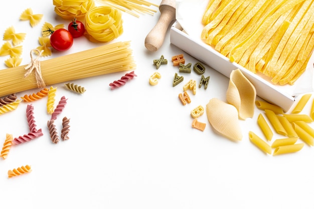 Flat lay uncooked pasta mix with tomatoes