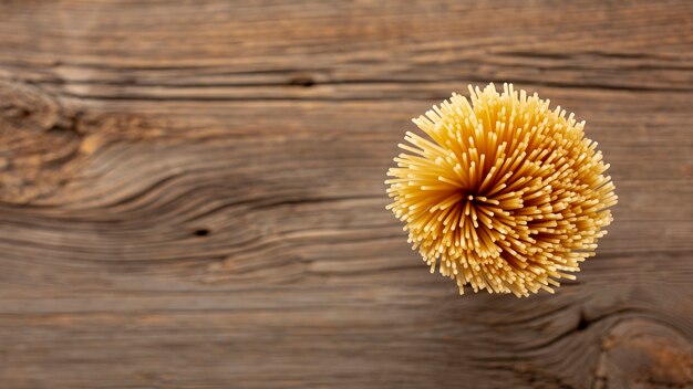 Flat lay uncooked spaghetti with copy space