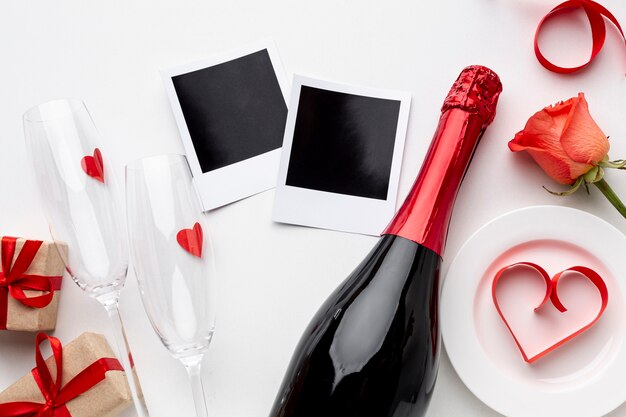 Flat lay valentine's day composition with champagne and glasses
