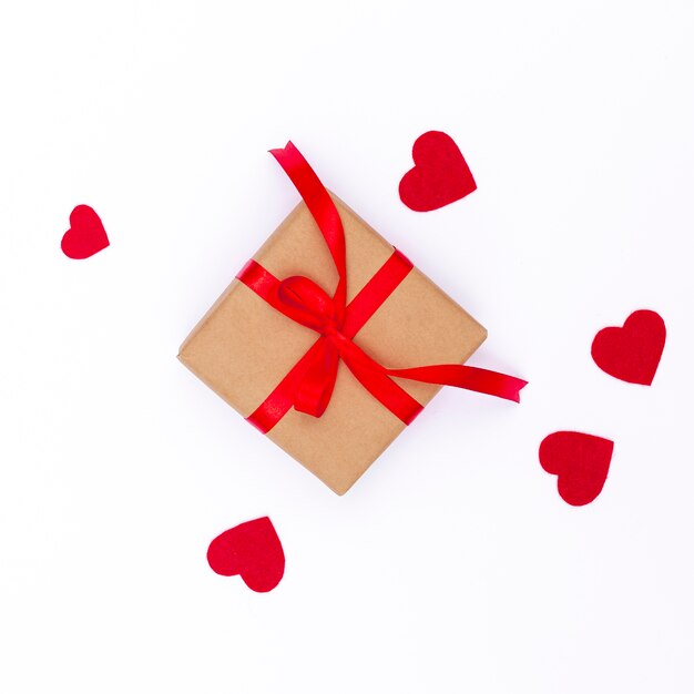 flat lay of valentines day gift with hearts and ribbon