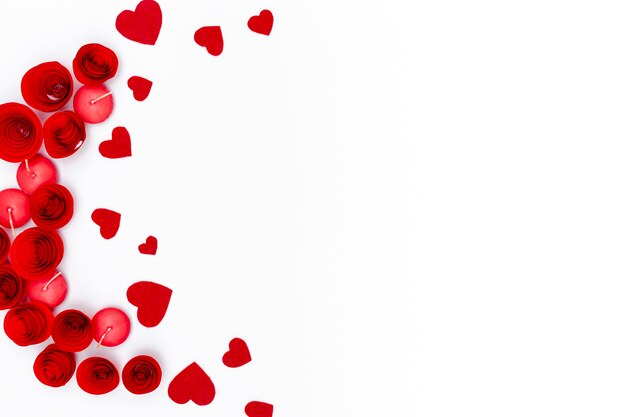 flat lay of valentines day hearts with candles and copy space