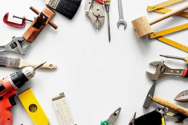 Flat lay of various technician tools isolated on white background