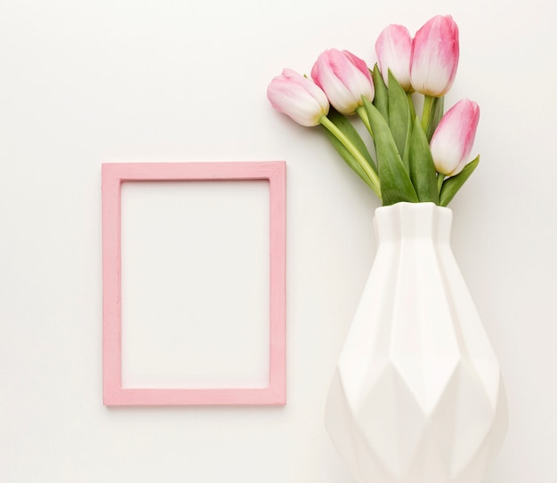 Free photo flat lay vase with tulips