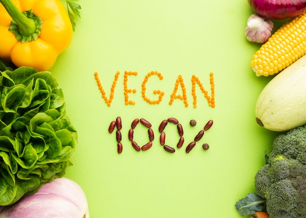 Free photo flat lay vegan 100% lettering