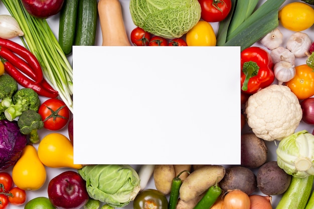 Free photo flat lay vegetables and empty paper