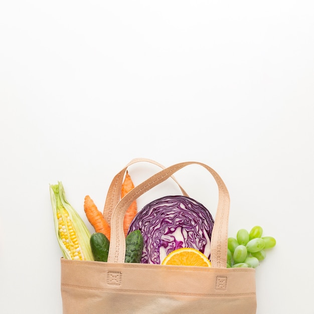 Flat lay vegetables and fruits in bag