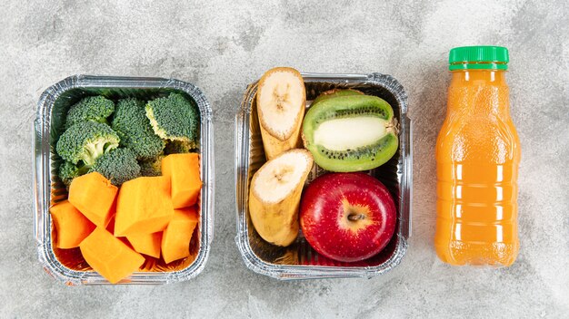Flat lay of vegetables and fruits in casseroles