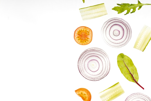 Flat lay vegetables slices with copy space