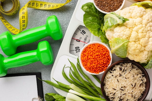 Flat lay of vegetables and weights